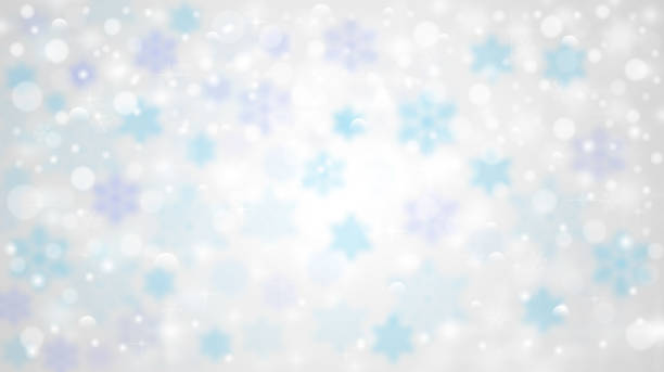 Winter background with blurred snow falling stock photo