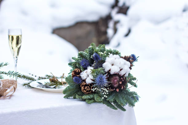 Winter bouquet of the bride. Fir branches, cotton flowers in a bride's bouquet stock photo