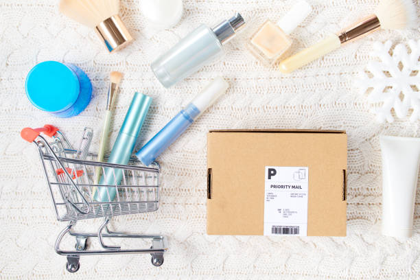 winter flat lay with cosmetics, parcel and snowflake stock photo
