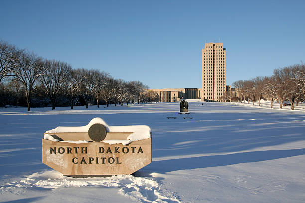 Winter North Dakota Capital North Dakota Capitol in winter setting. north dakota stock pictures, royalty-free photos & images