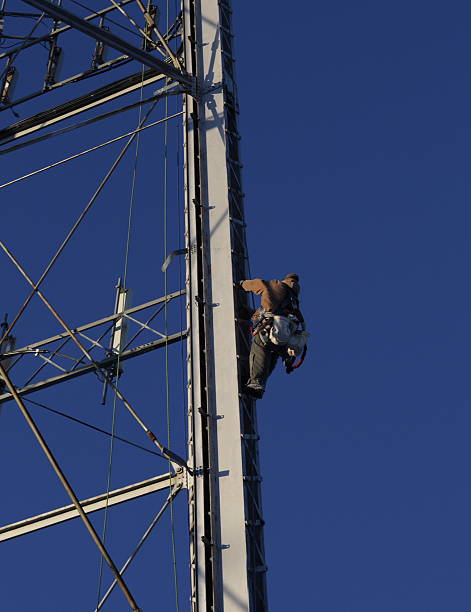 Winter Repairs to Telecommunications Tower stock photo