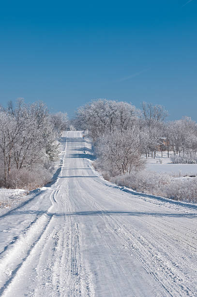 Winter scene on a country road in rural Iowa stock photo