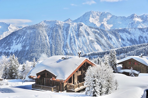 Winter scenery with beautiful chalet in ski resort Courchevel