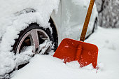 istock Winter tire. Detail of car tires in winter on the road covered with snow. 1359419504