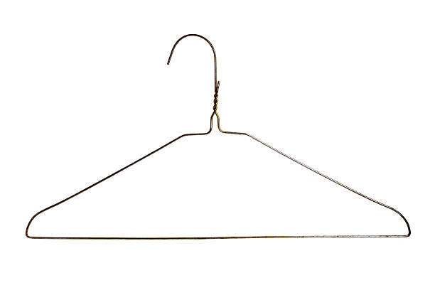 A wire hanger and a white backboard stock photo