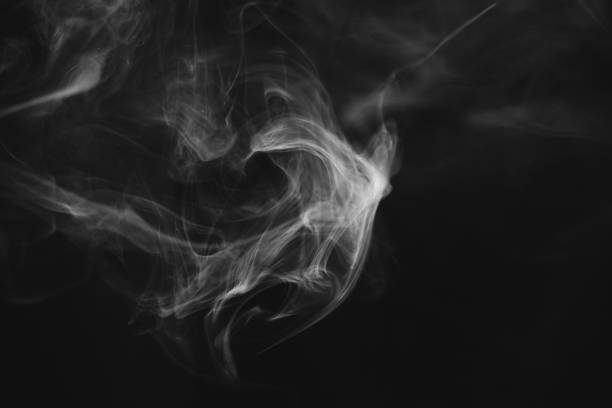 Wispy Vape Smoke Background An idyllic background of textured wispy electronic cigarette smoke, backlit by the beautiful morning light. wispy stock pictures, royalty-free photos & images