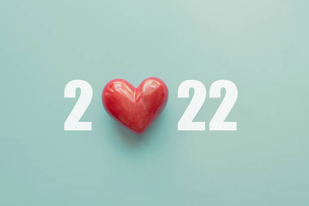 2022 with red heart. Happy New Year for heart health insurance, donation and medical concept,  New Year resolutions goal stock photo