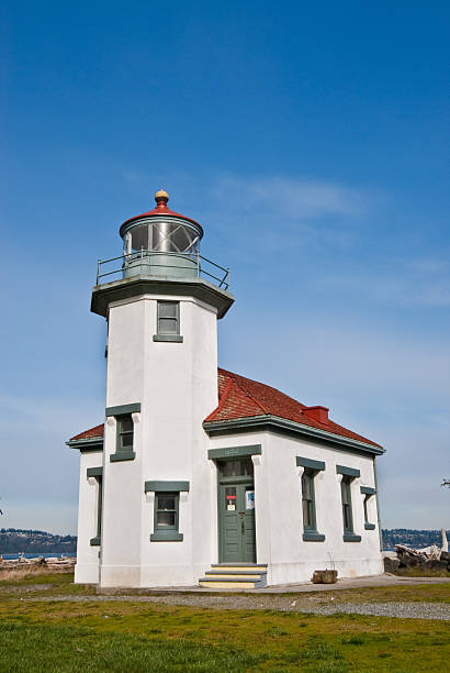 Point Robinson Lighthouse With the advent of radar, GPS and other advanced navigation tools, lighthouses no longer need to perform the same function they once did; guiding ships to safety. Instead they have been preserved as historic monuments; reminding us of a time when shipping and sailing were more perilous activities. The Point Robinson Lighthouse is located on Vashon Island, Washington State, USA. jeff goulden lighthouse stock pictures, royalty-free photos & images