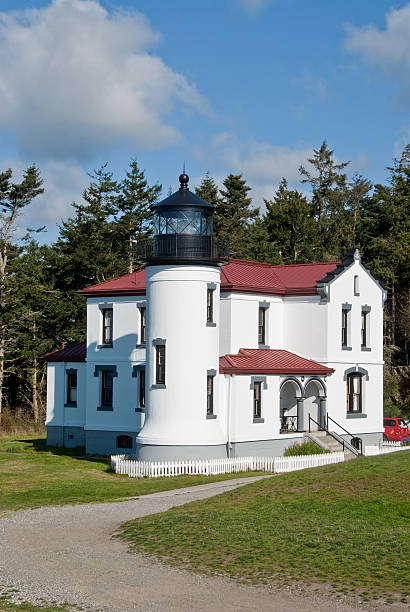 Admiralty Head Lighthouse With the advent of radar, GPS and other advanced navigation tools, lighthouses no longer need to perform the same function they once did; guiding ships to safety. Instead they have been preserved as historic monuments; reminding us of a time when shipping and sailing were more perilous activities. The Admiralty Head Lighthouse is located at Fort Casey State Park on Whidbey Island, Washington State, USA. jeff goulden puget sound stock pictures, royalty-free photos & images
