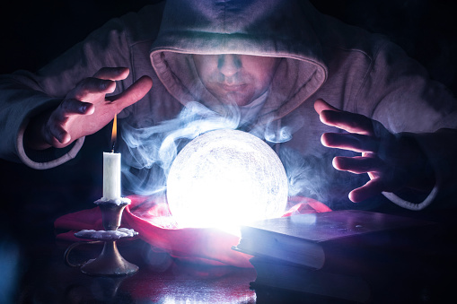 Wizard With Hood And Lights Smoke Magic Crystal Ball Stock Photo - Download  Image Now - iStock