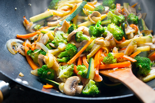 Wok stir fry with vegetables steaming