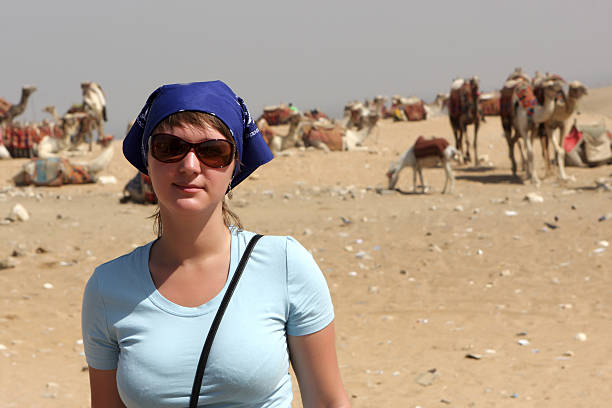 Woman and camels The woman poses on a camels background, Egypt hot egyptian women stock pictures, royalty-free photos & images