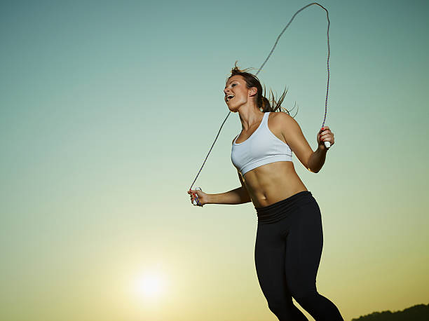 Woman and skipping rope stock photo