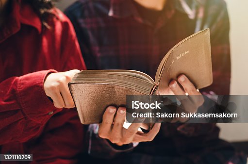 istock A woman and two men were studying and reading the Bible. That is Christian love 1321110209