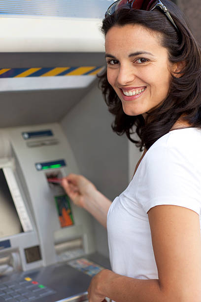 Woman at the ATM stock photo