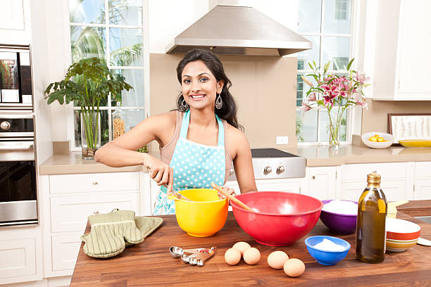 Woman Baking in Kitchen stock photo