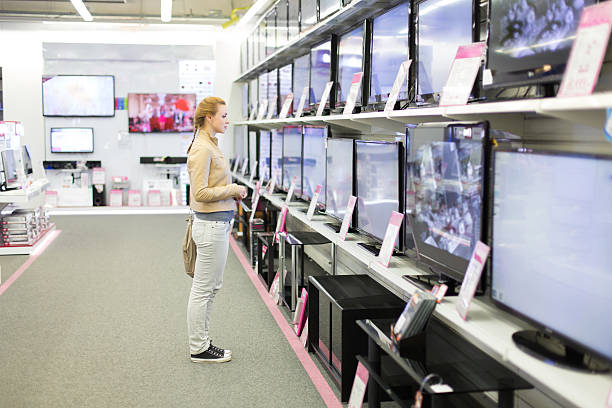 woman buys the TV stock photo