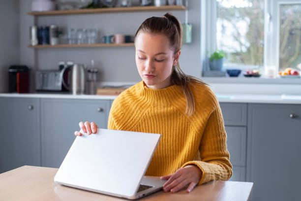 Woman Concerned About Excessive Use Of Internet Closing Lid Of Laptop Computer Woman Concerned About Excessive Use Of Internet Closing Lid Of Laptop Computer fomo photos stock pictures, royalty-free photos & images