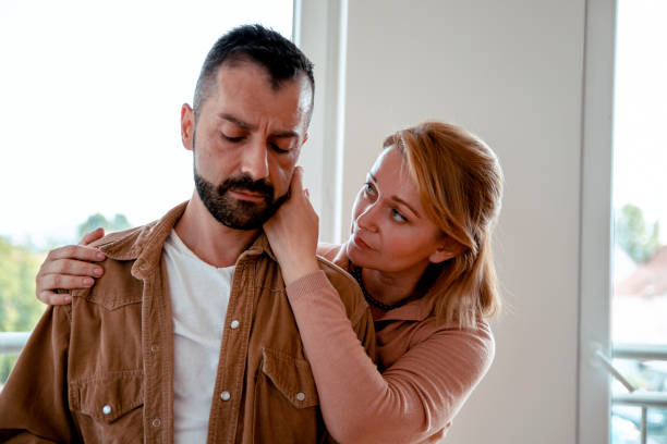 Woman consoling Man stock photo