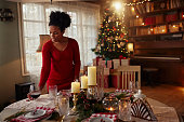 istock Woman decorated Christmas place table setting. 1350635820