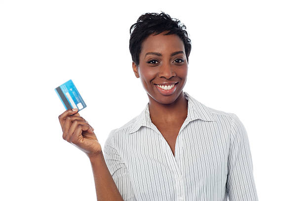 Woman displaying her cash card stock photo