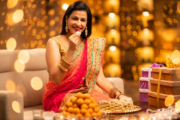 Woman Diwali Celebrate At Home - Stock Photo Indian, Indian culture, Indian ethnicity, Diwali, Festival, mithai stock pictures, royalty-free photos & images