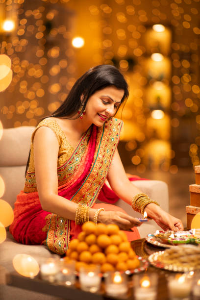 Woman Diwali Celebrate At Home - Stock Photo Indian, Indian culture, Indian ethnicity, Diwali, Festival, mithai stock pictures, royalty-free photos & images