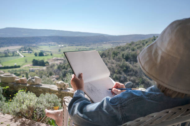 Woman drawing in Provence stock photo