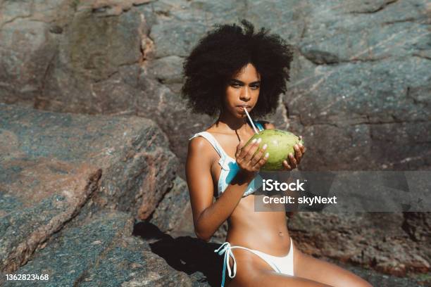A woman drinking coconut water