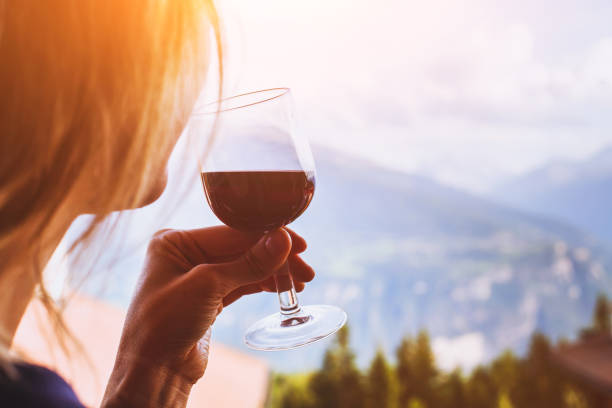 woman drinking red wine - sniffing glass imagens e fotografias de stock