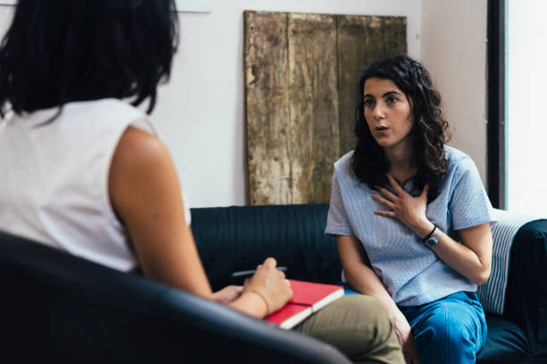 Woman during a psychotherapy session Woman during a psychotherapy session counseling stock pictures, royalty-free photos & images