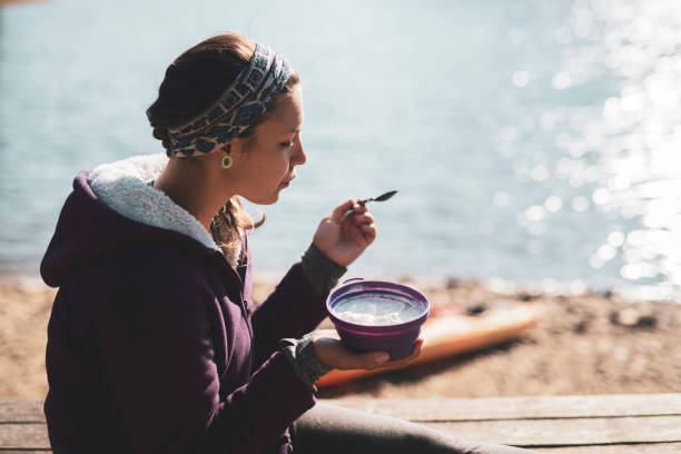 Photo of Woman eating healthy food outdoor.