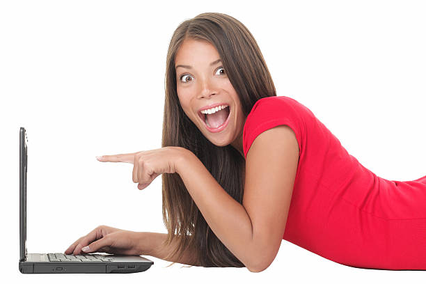 Woman excited with laptop stock photo