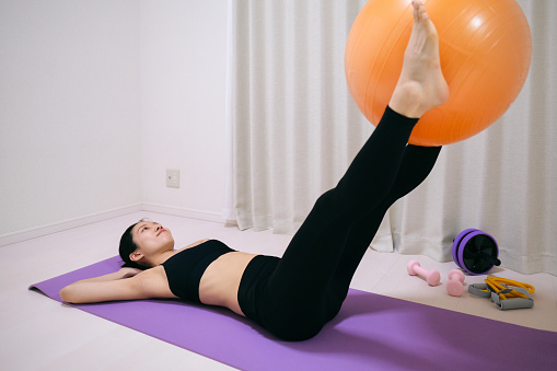 Woman exercising with fitnessball
