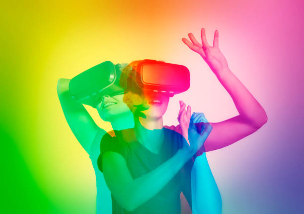 LGBT woman exploring virtual reality. Double exposure Young woman wearing VR headset and rainbow background. Virtual dating virtual reality point of view stock pictures, royalty-free photos & images