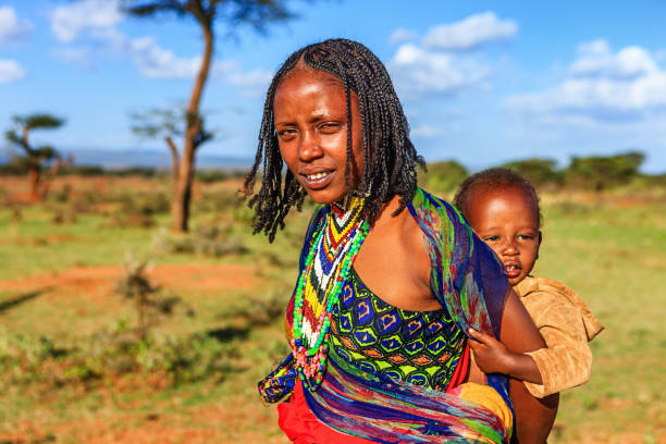Woman from Borana tribe carrying her baby, Ethiopia, Africa stock photo