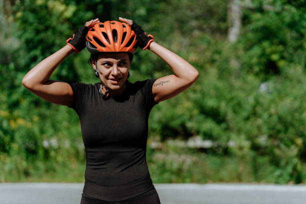 Woman getting ready for a bike ride stock photo