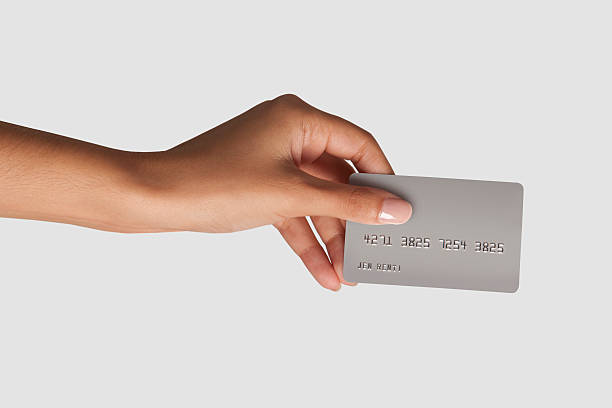 Woman hand holding fake credit card stock photo