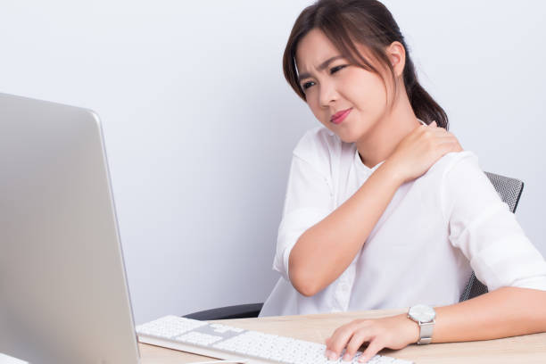 Woman has shoulder pain from work stock photo