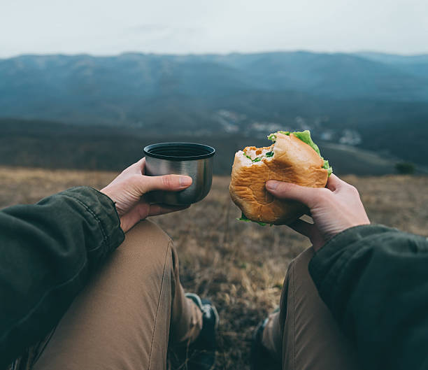 Woman have lunch on nature stock photo