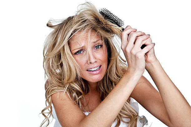 Woman having a bad hair day stock photo