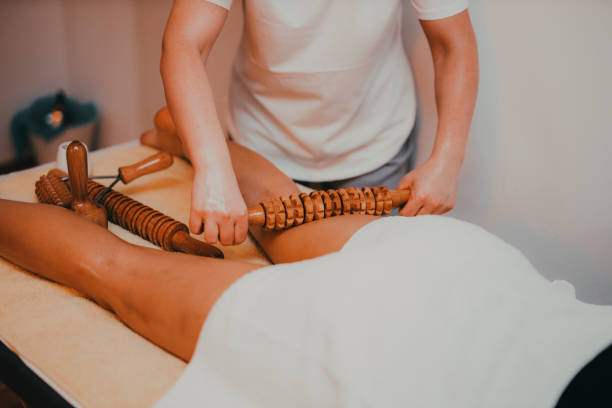Woman having a massage with rolling pins stock photo