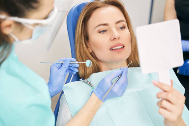Woman having dental examination in stomatology clinic stock photo