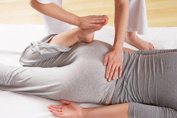Woman having Shiatsu massage stock photo