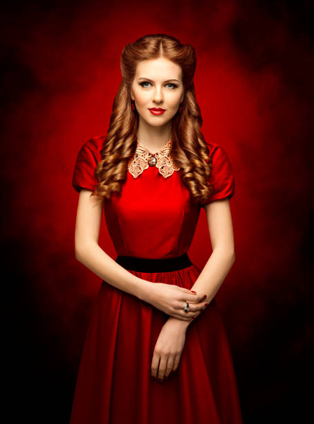 Woman Historical Hairstyle and Retro Dress, Fashion Model in Red Victorian Gow Woman Historical Hairstyle and Retro Dress, Fashion Model in Red Victorian Period Style Gown victorian gown stock pictures, royalty-free photos & images