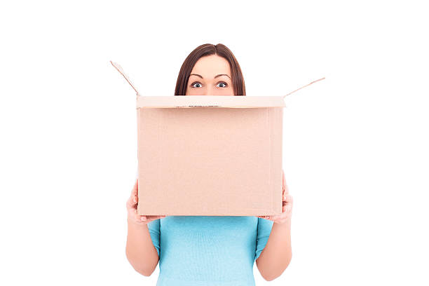 Woman holding a box. Stock Image. stock photo