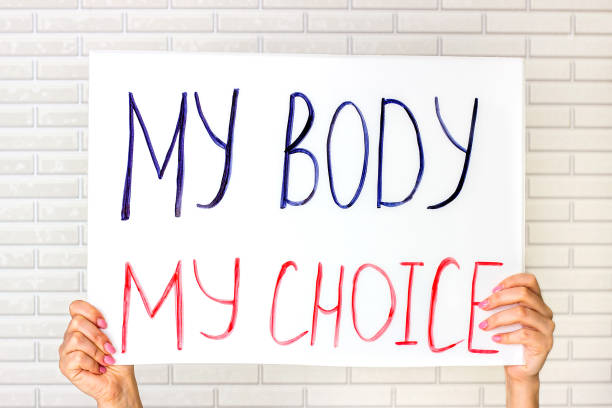 Woman holding a placard with My Body My Choice text. Reproductive women and pro-abortion rights protest concept stock photo