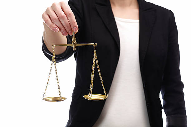 woman holding a scales of justice stock photo