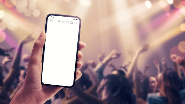 Woman holding a smartphone at the disco stock photo