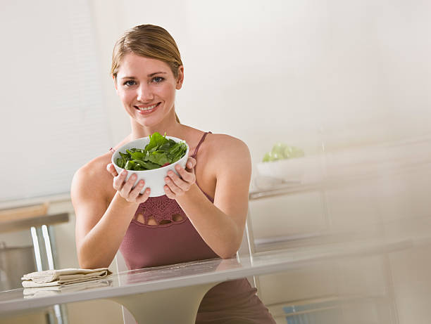 Woman Holding Bowl of Salad stock photo